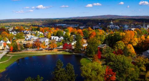 Drone image over White Park, facing the law school, with fall leaves